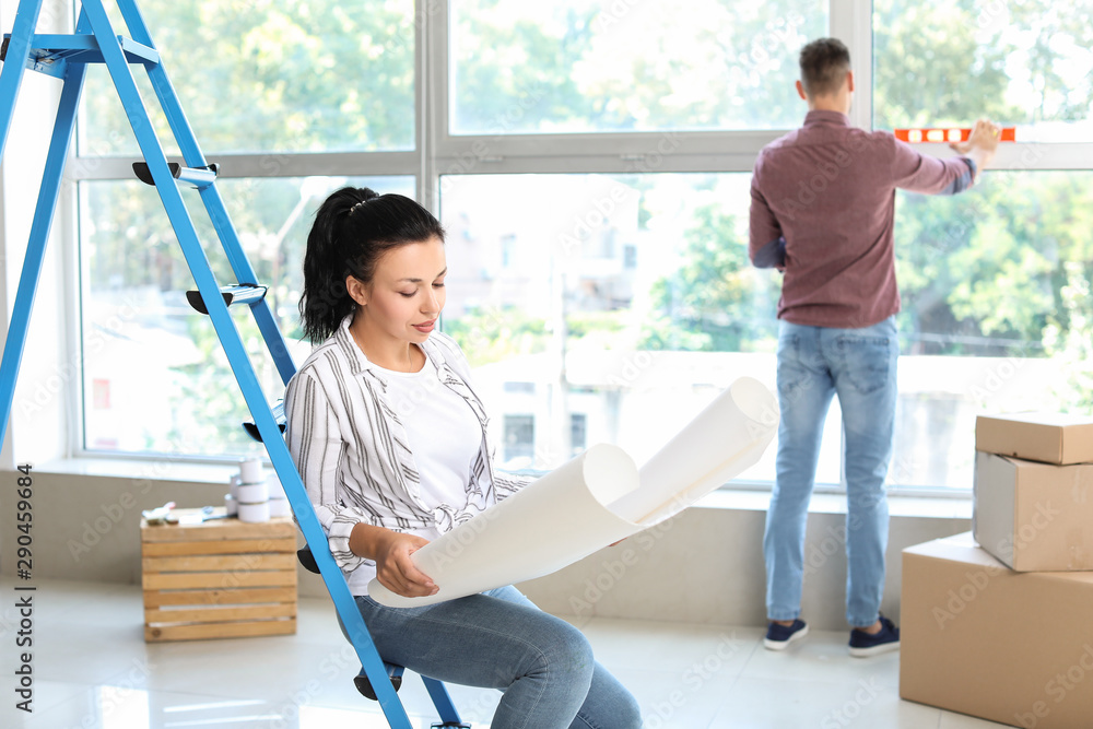 Woman planning design of her new house