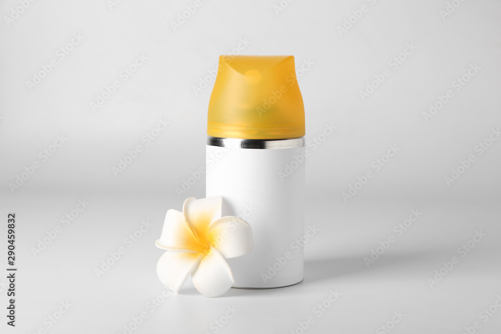 Bottle of air freshener on light background