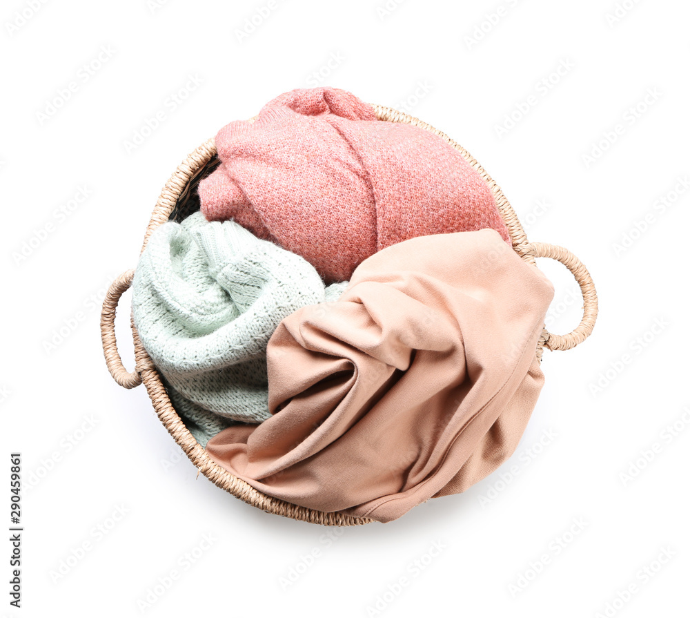 Basket with laundry on white background