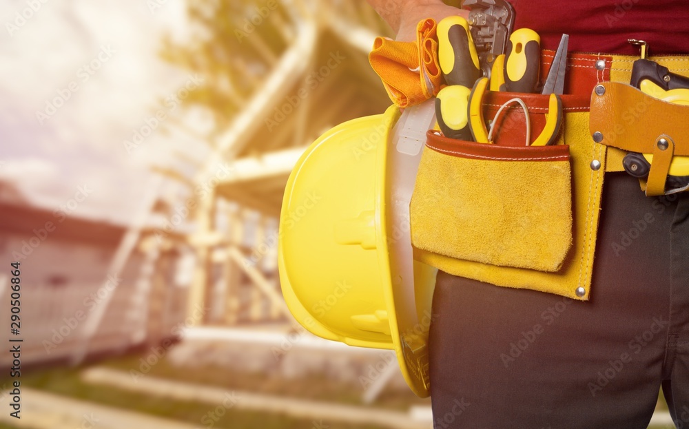 Worker with a tool belt. Isolated over white background.