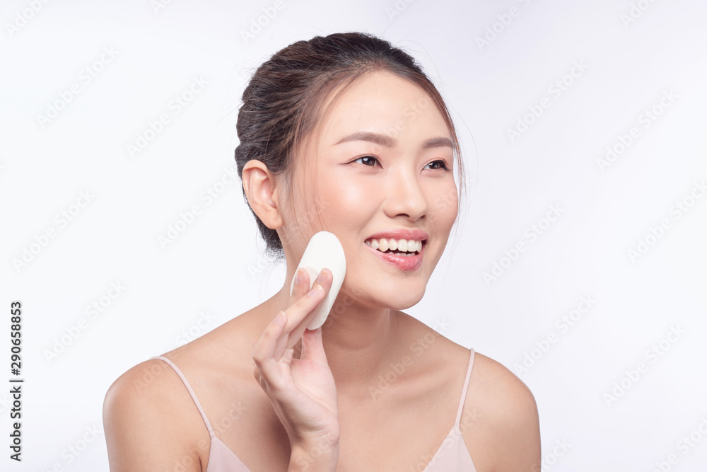 natural beautiful woman with powder puff on white background