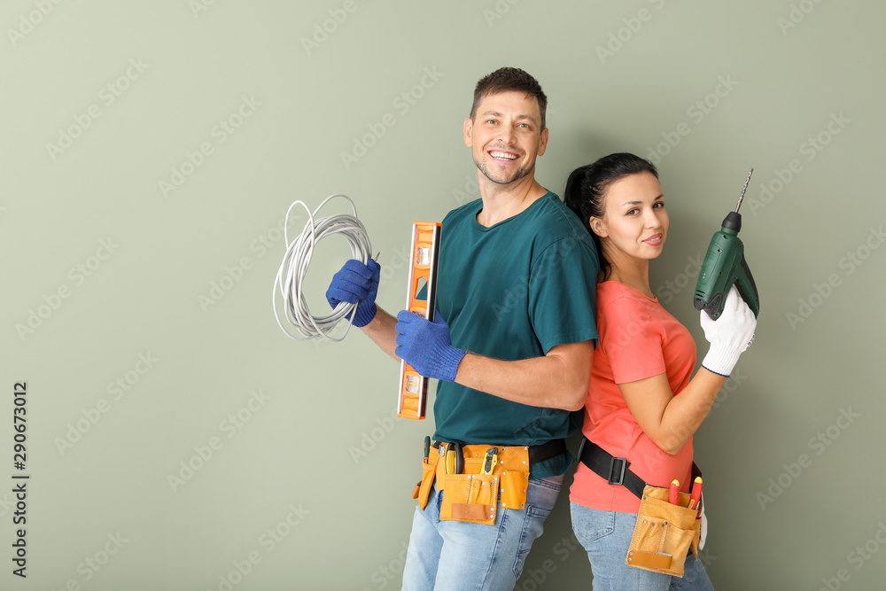 Happy couple with supplies during repair in their new house