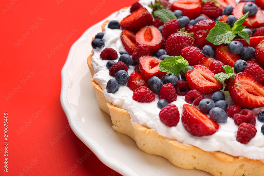 Tasty berry pie on color background, closeup