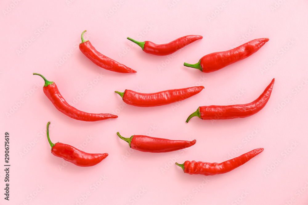 Red chili peppers on color background