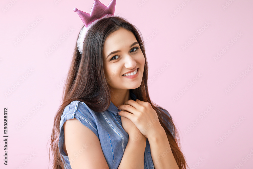 Portrait of happy young woman on color background