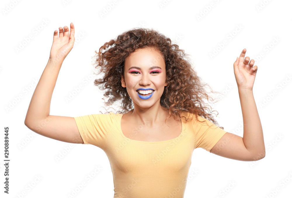 Portrait of fashionable young African-American woman on white background