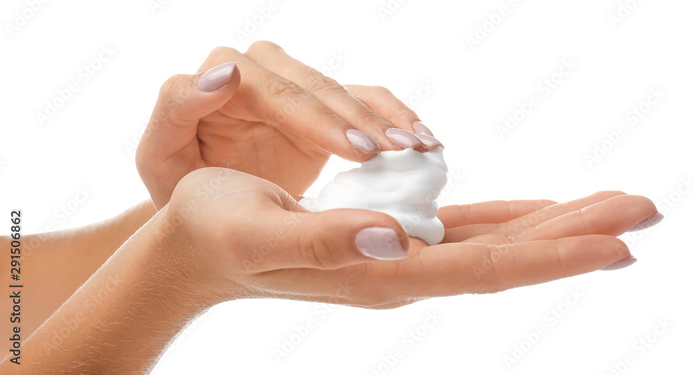 Female hands with soap foam on white background