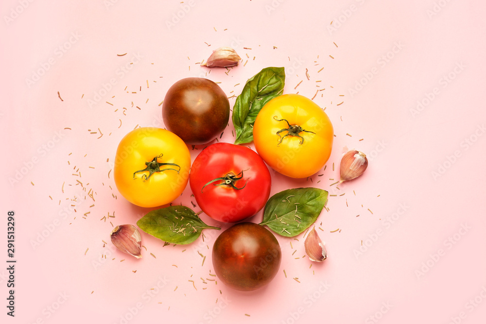 Different fresh tomatoes on color background