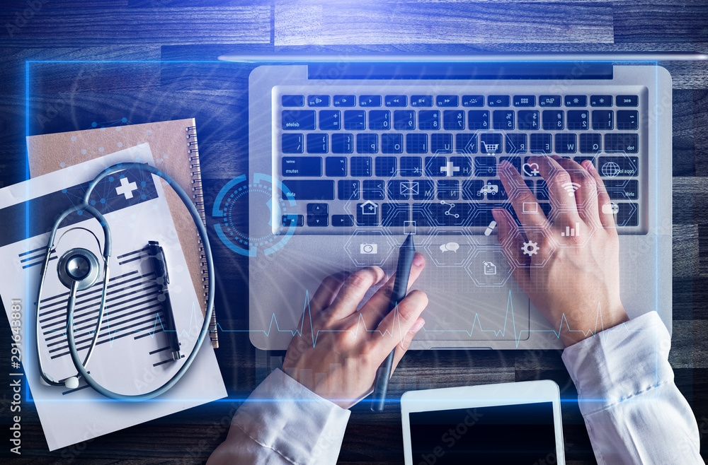 Top view. medical technology concept,smart doctor hand working with modern laptop computer in modern