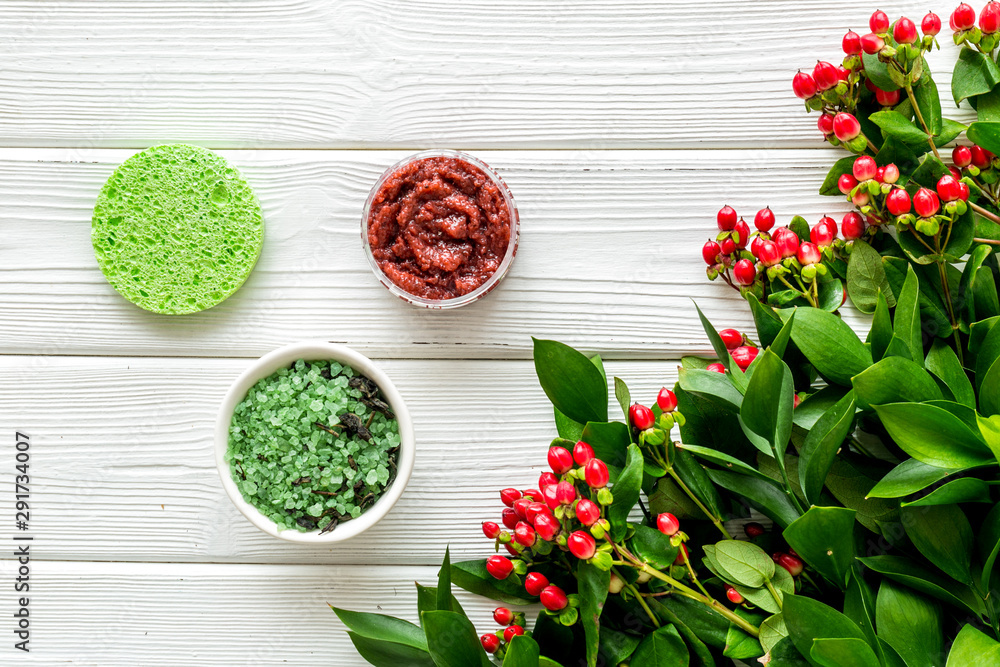 skin care with natural cosmetics with herbal extract on white wooden background top view