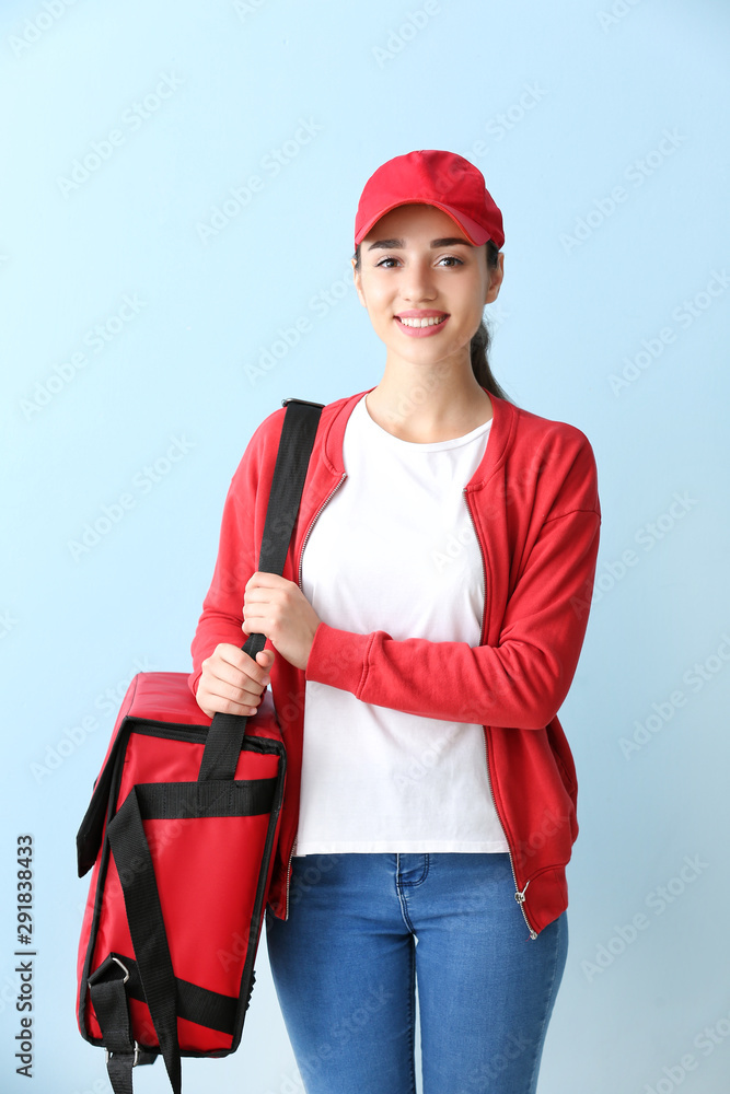 Female worker of food delivery service on color background