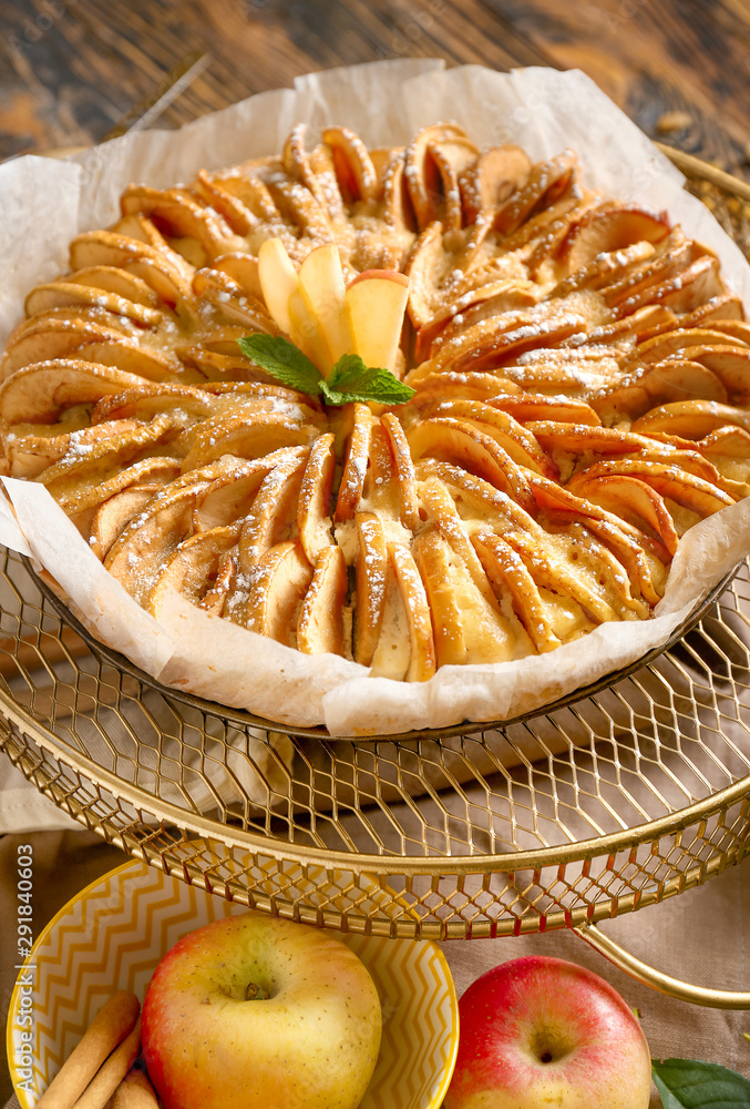 Sweet apple pie on wooden table