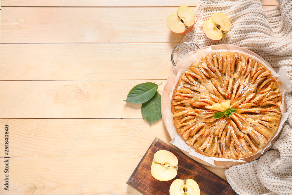 Sweet apple pie on wooden table