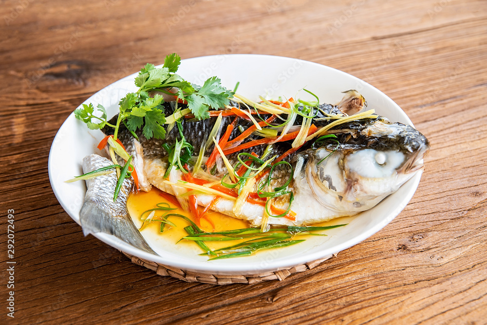 Chinese dish of steamed aconite on wooden table