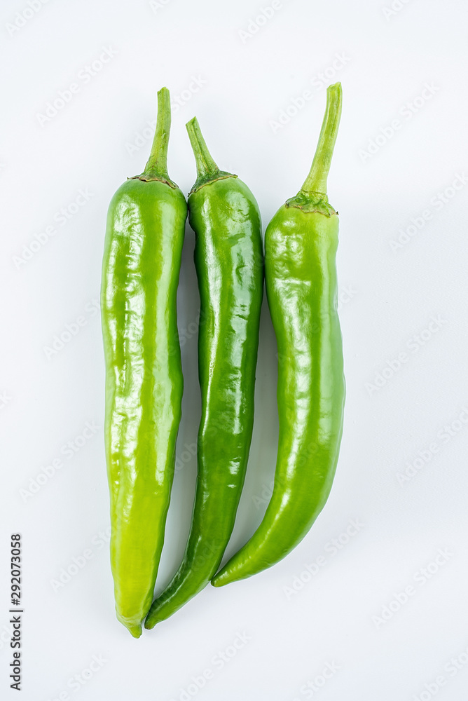 Fresh green green pepper on white background