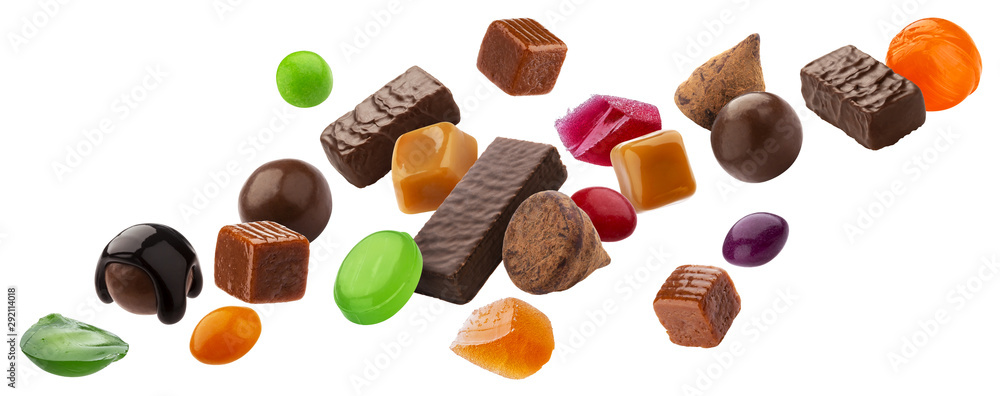 Various jelly candies, caramels, lollipops isolated on white background with clipping path