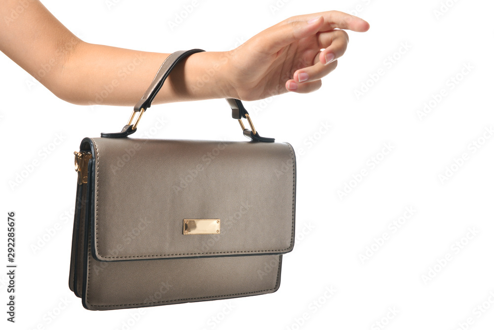 Female hand with leather bag on white background