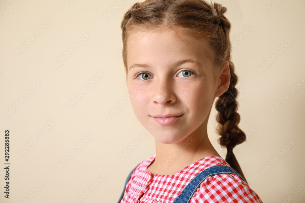 Cute little girl on light background