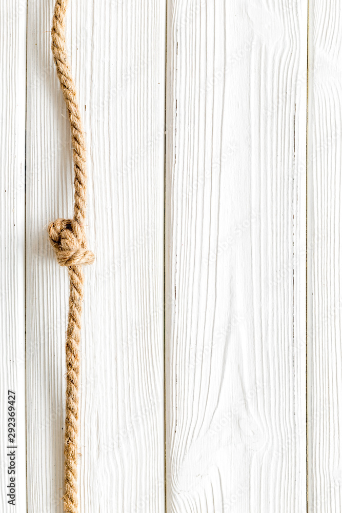 rope frame on white wooden background top view mock up