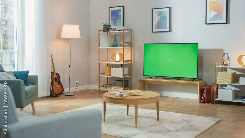 Cozy Living Room with Stylish Furniture and Design, Green Chroma Key TV in the Middle of the Room.