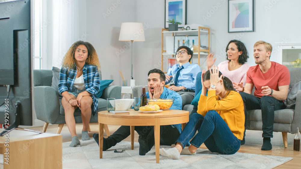 In the Living Room Diverse Group of Friends on Watching Sports Game Match on TV, They Cheer and Chan