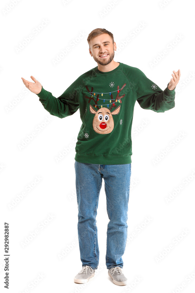 Young man in Christmas sweater on white background