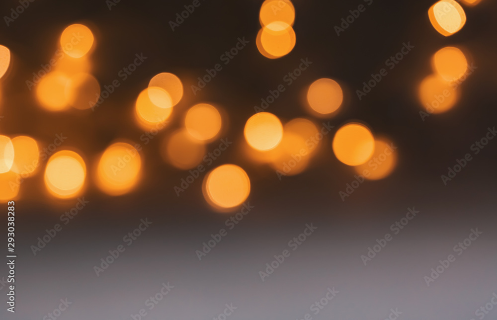 Abstract blurred shiny bokeh lights black background