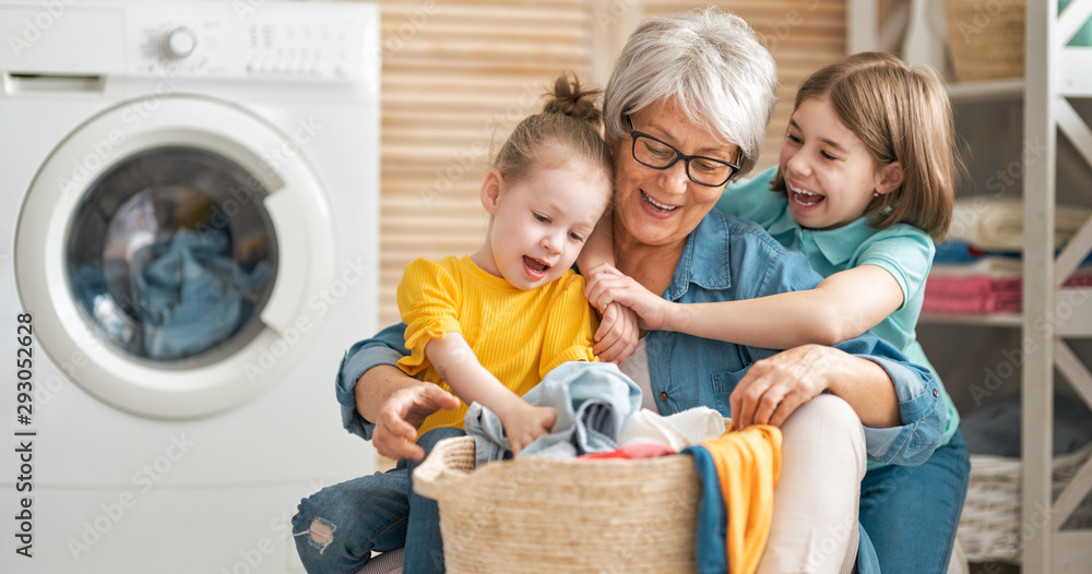 grandma and children are doing laundry