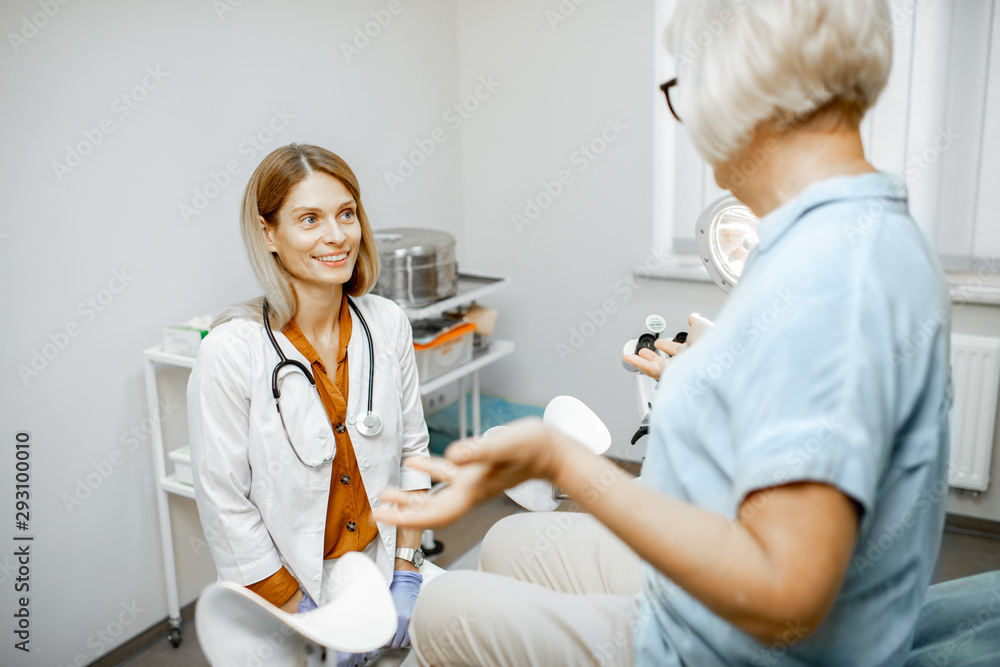 Gynecologist listening to a senior woman patient during a medical consultation in gynecological offi