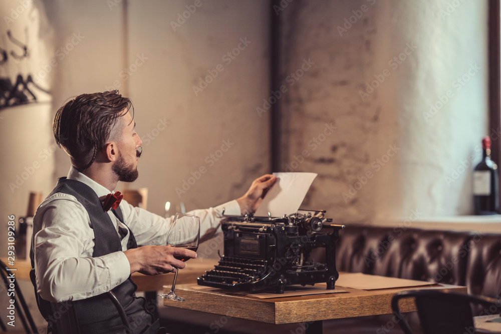 Young writer with a typewriter indoors