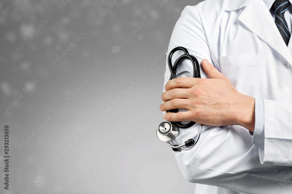 Portrait of  doctor  with arms crossed in medical office