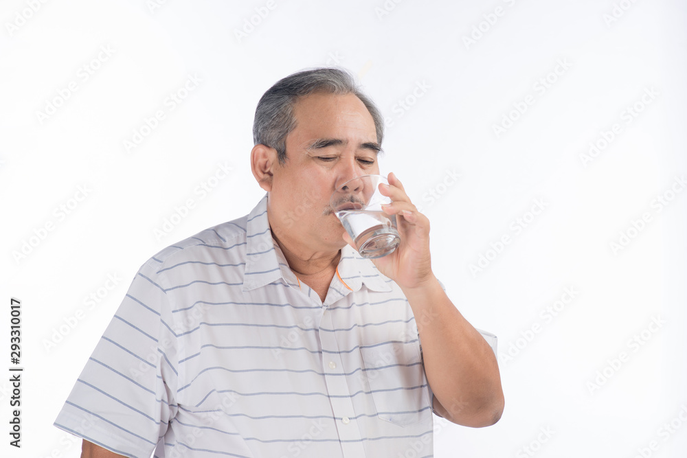 Asian Senior man drinking water. Elderly male holding transparent glass in his hand.