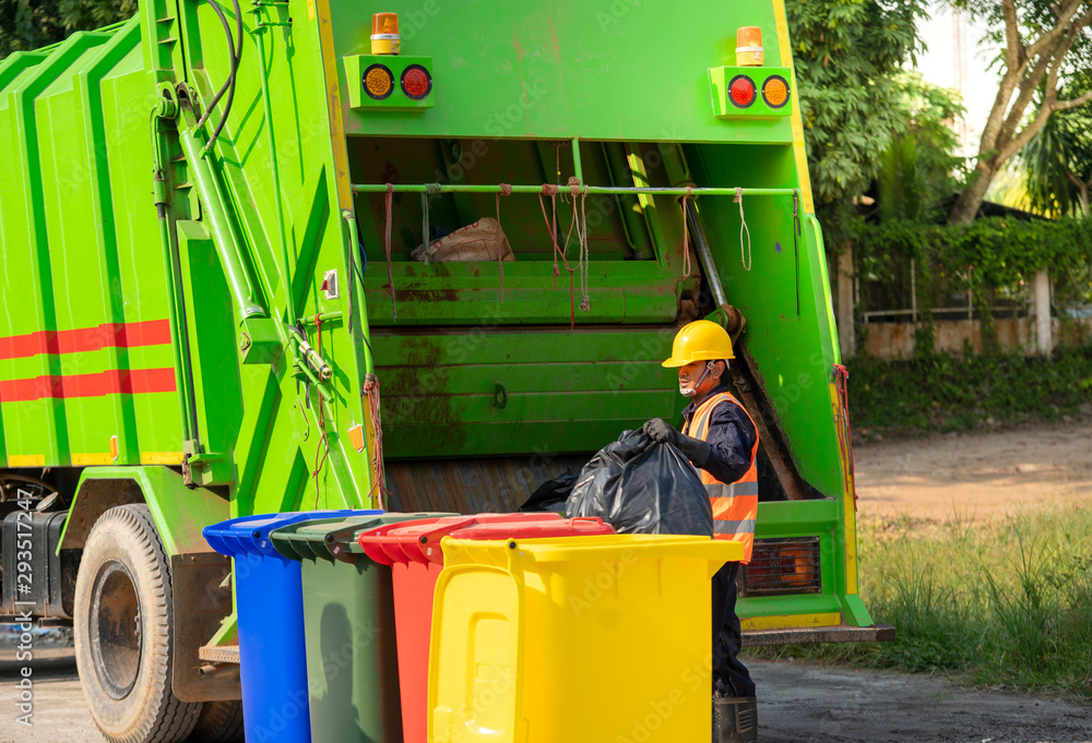 Recyclable garbage truck and the keeper  in the village.