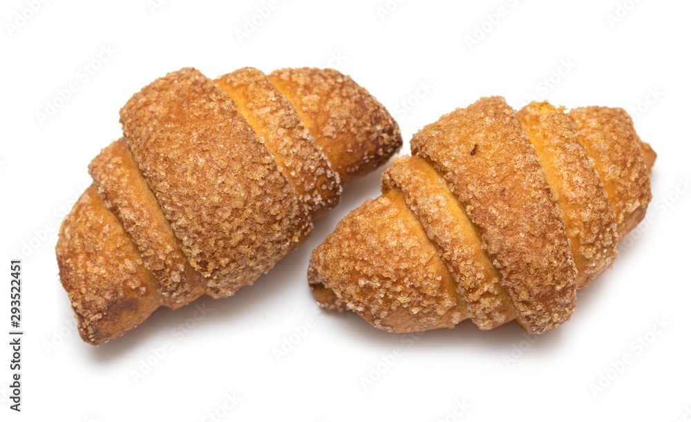 Homemade croissant cookies on a white background.