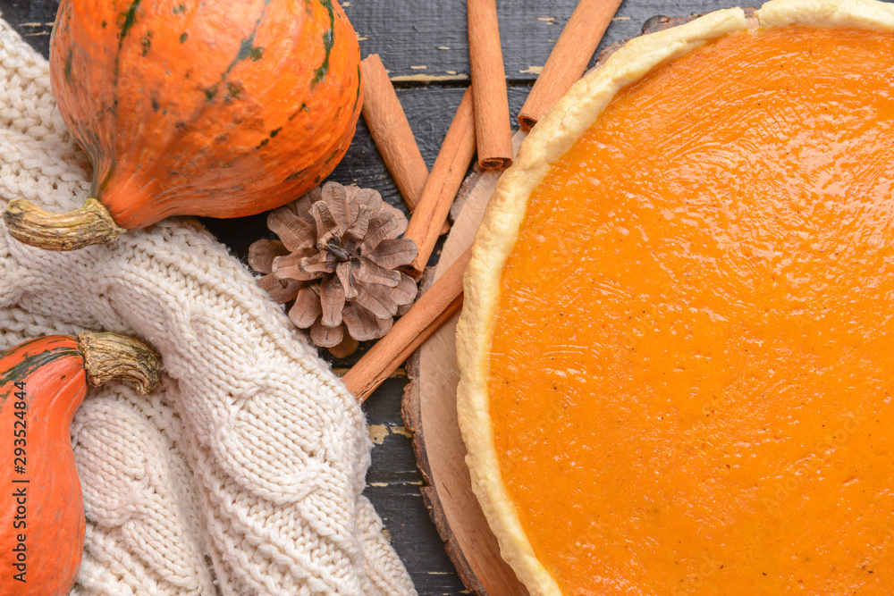 Tasty pumpkin pie on wooden table, closeup