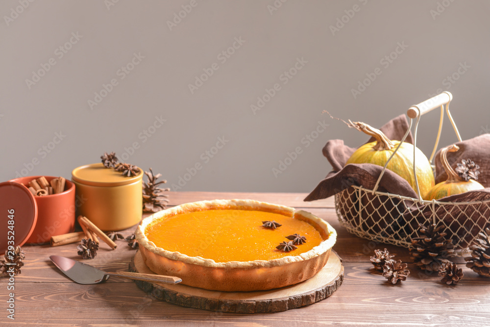 Tasty pumpkin pie on wooden table