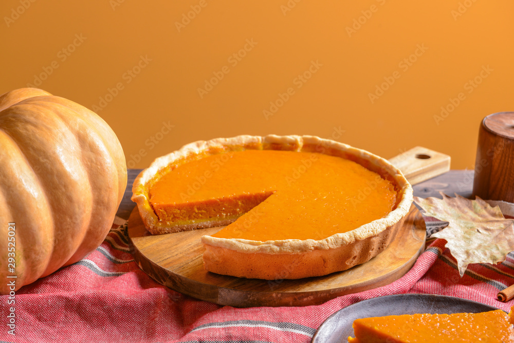 Fresh tasty pumpkin pie on table