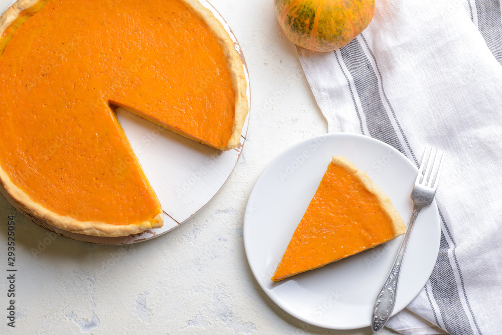 Fresh tasty pumpkin pie on table