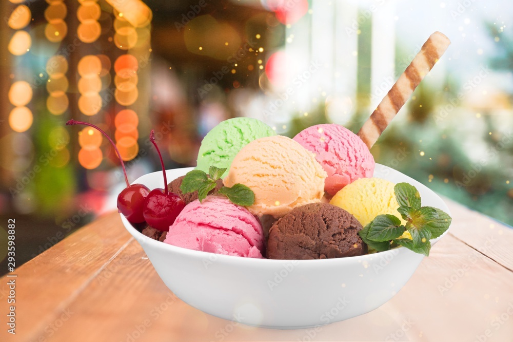 Ice cream scoops in bowl with wafer on white background