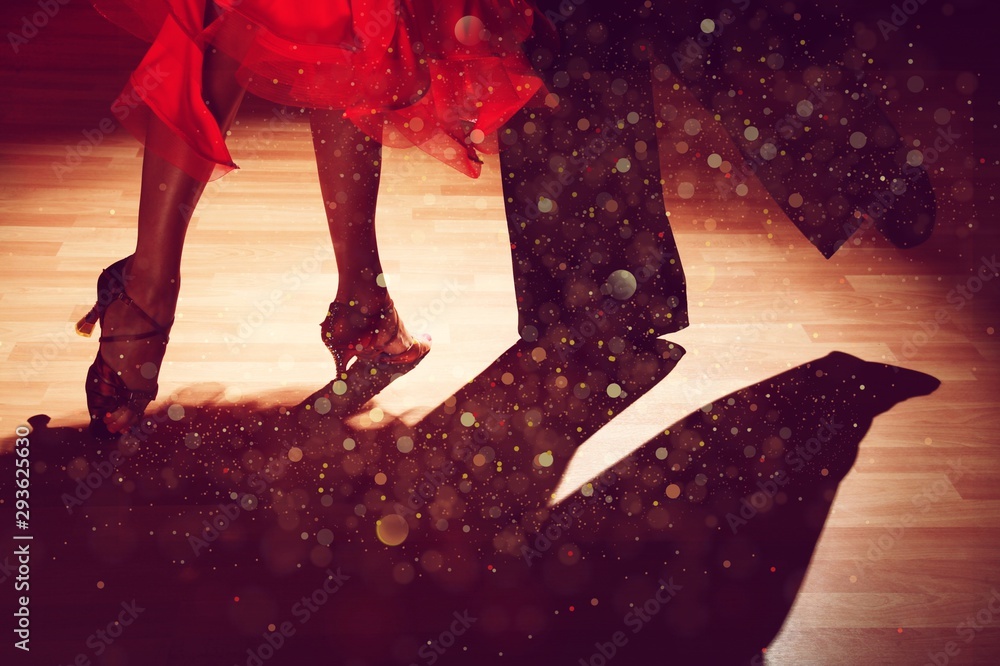 Young man and a woman dancing Salsa