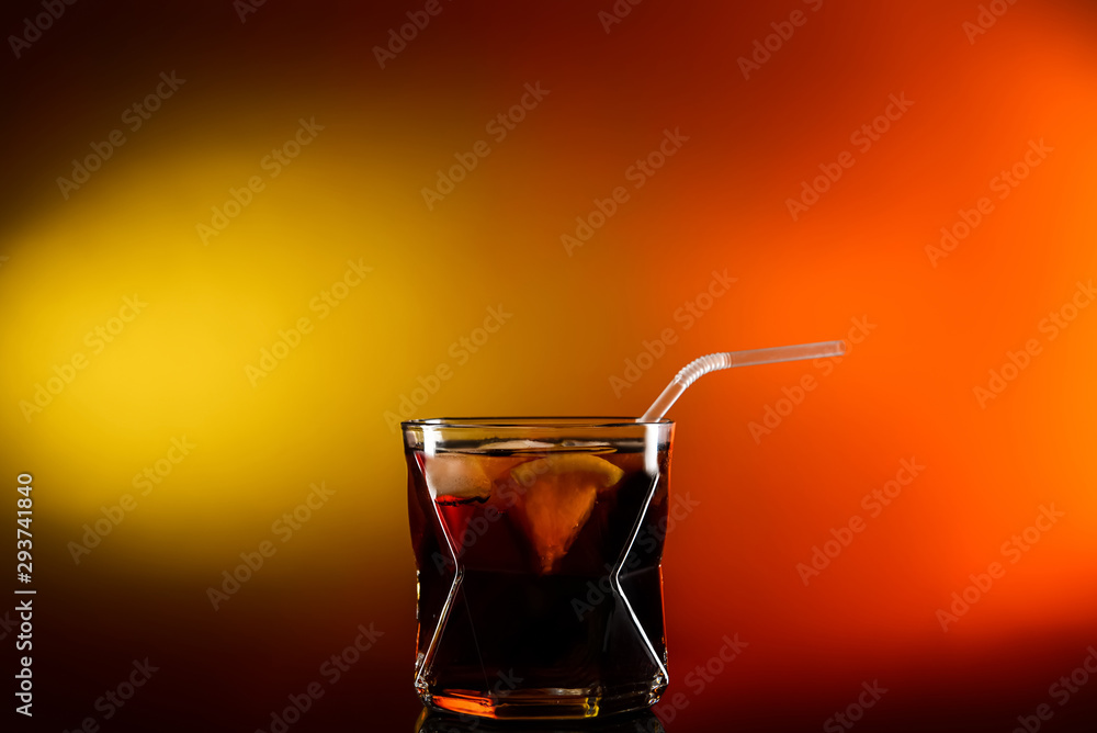 Glass of tasty summer cocktail on color background