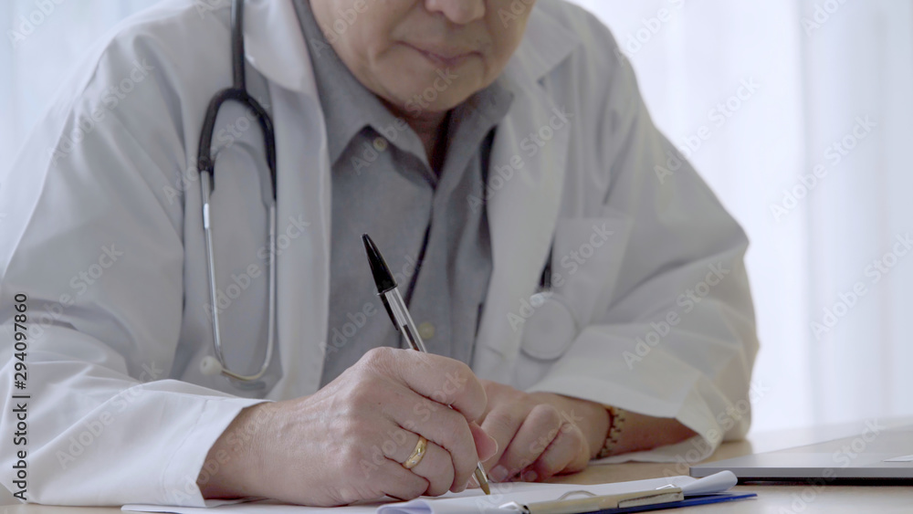 Doctor working with patient health data in the hospital office. Medical service and healthcare conce