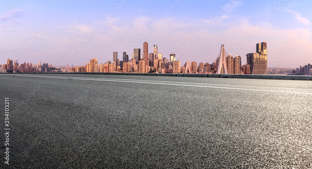 Asphalt highway passes through the city financial district in Chongqing at sunrise,China.