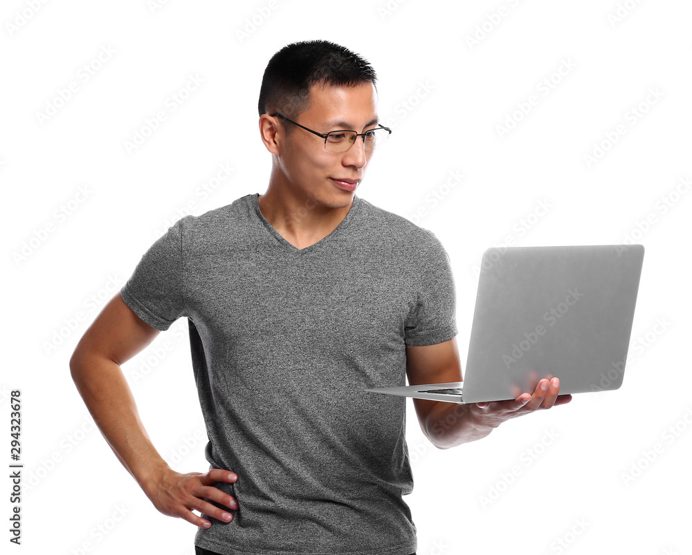 Male Asian programmer with laptop on white background