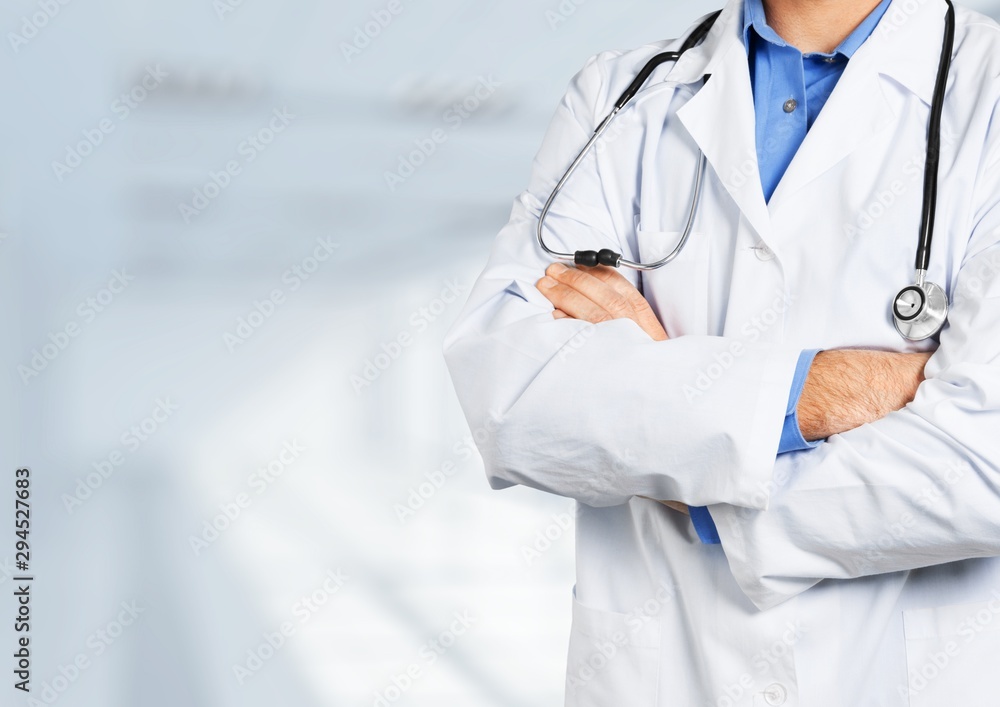 Portrait of  doctor  with arms crossed in medical office