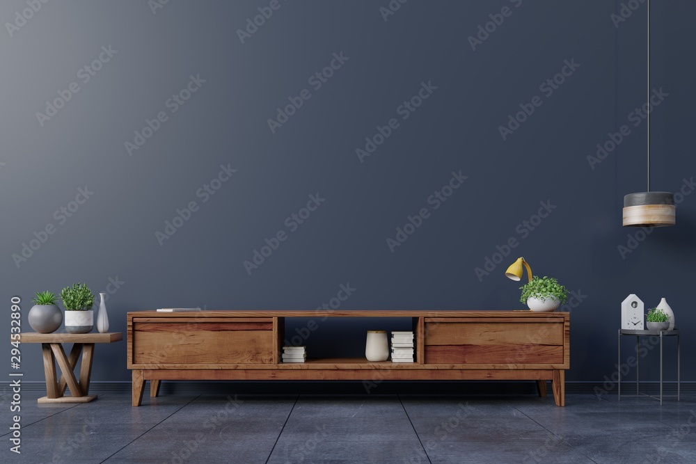 Cabinet TV in empty interior room ,dark wall with wood shelf,lamp ,plants and table wood.