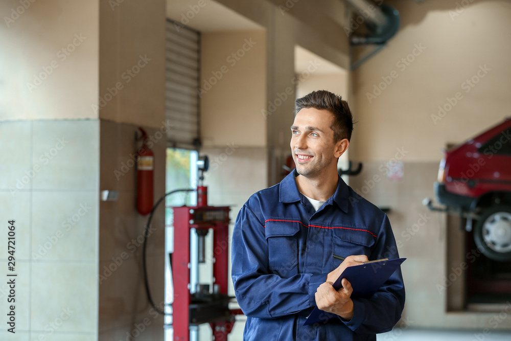 Male mechanic in car service center