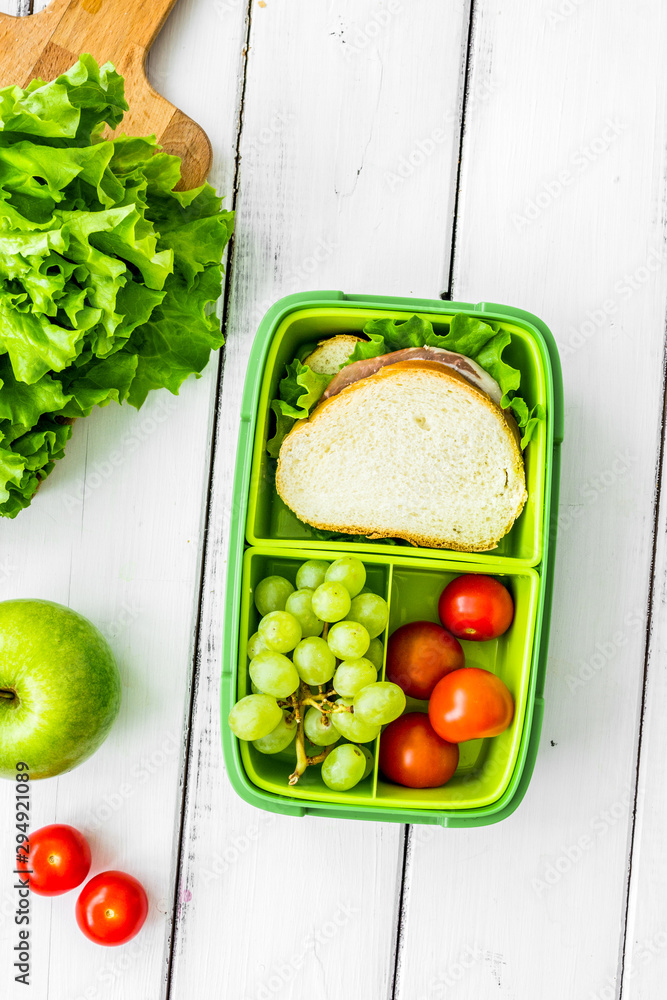 take away with lunchbox and fresh food on white background top view