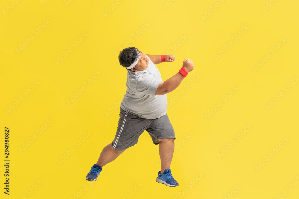 Fat man is exercising, he is fighting