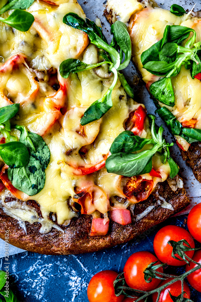 cooking pizza with vegetables and cheese on stone desk background top view